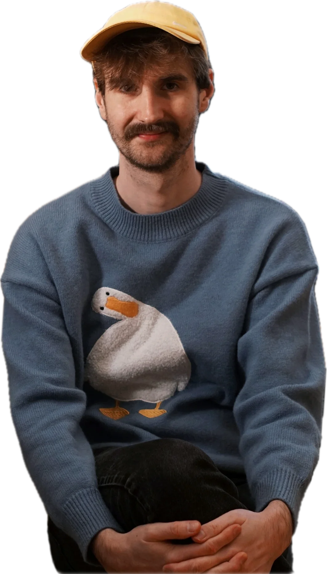 Andreas i en blå tröja med en gullig gås på